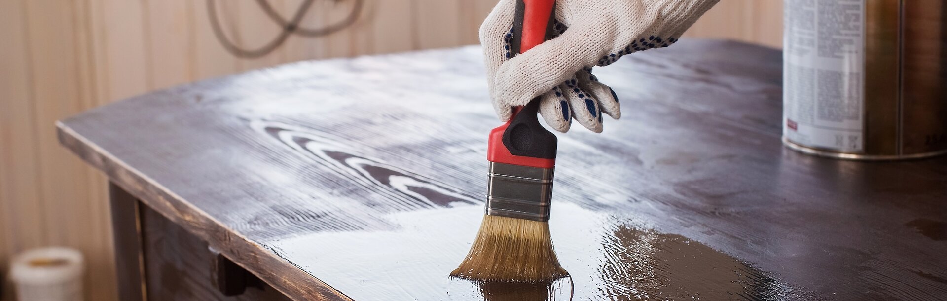 588612497 | Covering varnish of old wooden table. Restoration of furniture.